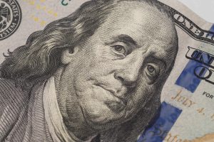 Dollars closeup. Benjamin Franklin's portrait on new one hundred dollar banknote.